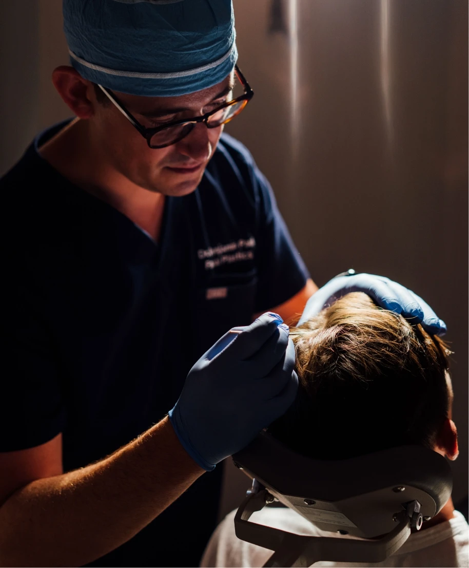 Dr. Ben Paul working with a male patient | Hair Restoration in NYC